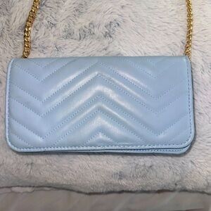 blue bag with gold strap 🩵